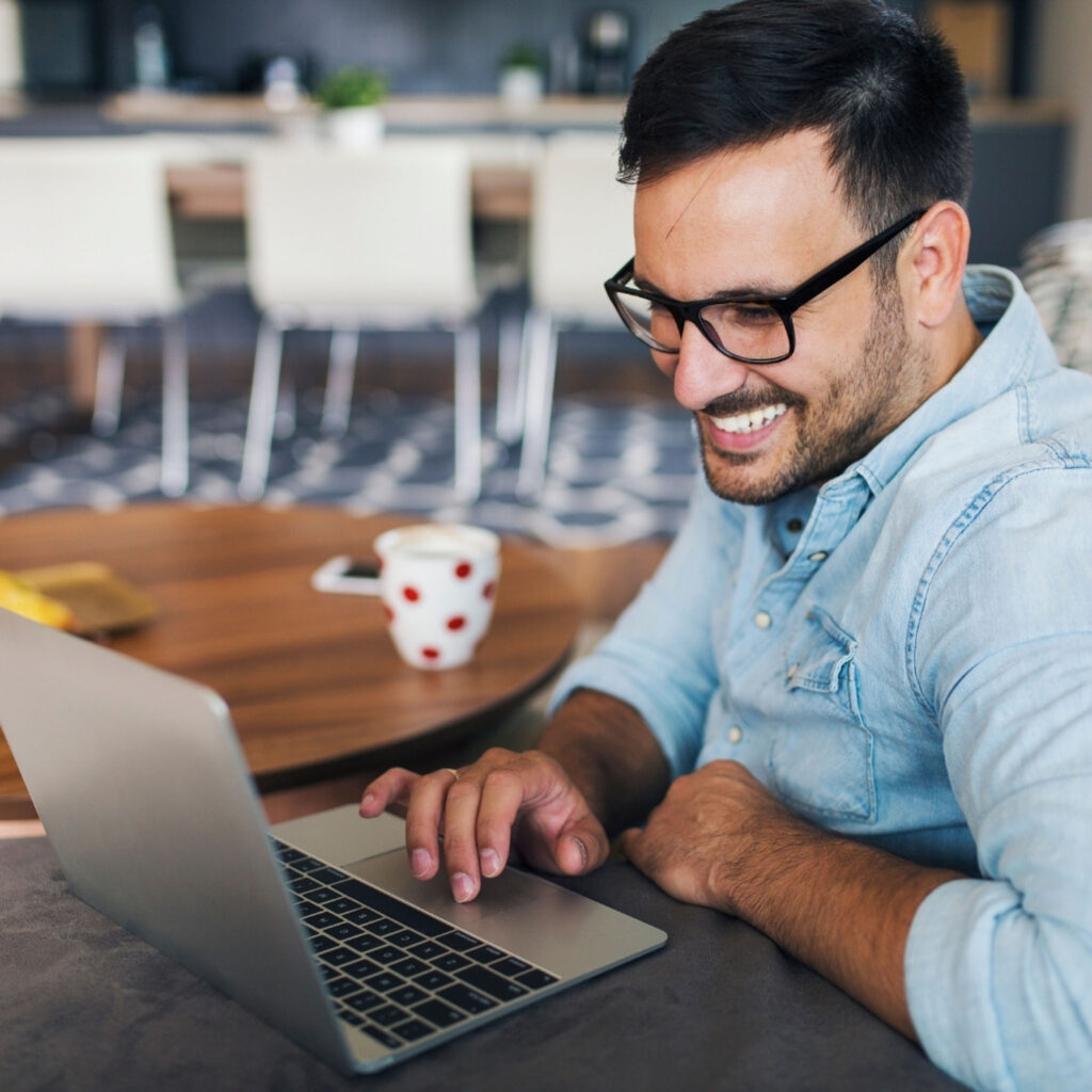 Maven is on their laptop in a cafe, Work-from-anywhere lifestyle in the Maven Movement